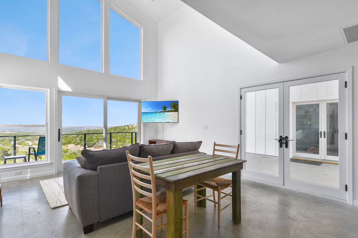 620 Windy Hills Road Dripping Springs, TX 78620 - Photo 19 of 30 Home 2 - Living area with concrete floors, and a high ceilings.