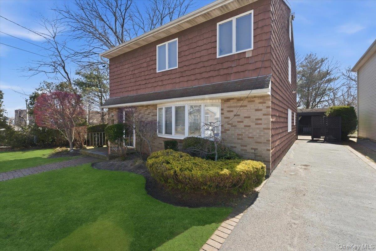 151 Wanser Avenue Inwood, NY 11096 - Photo 1 of 19 a view of a backyard with table and chairs and a fire pit