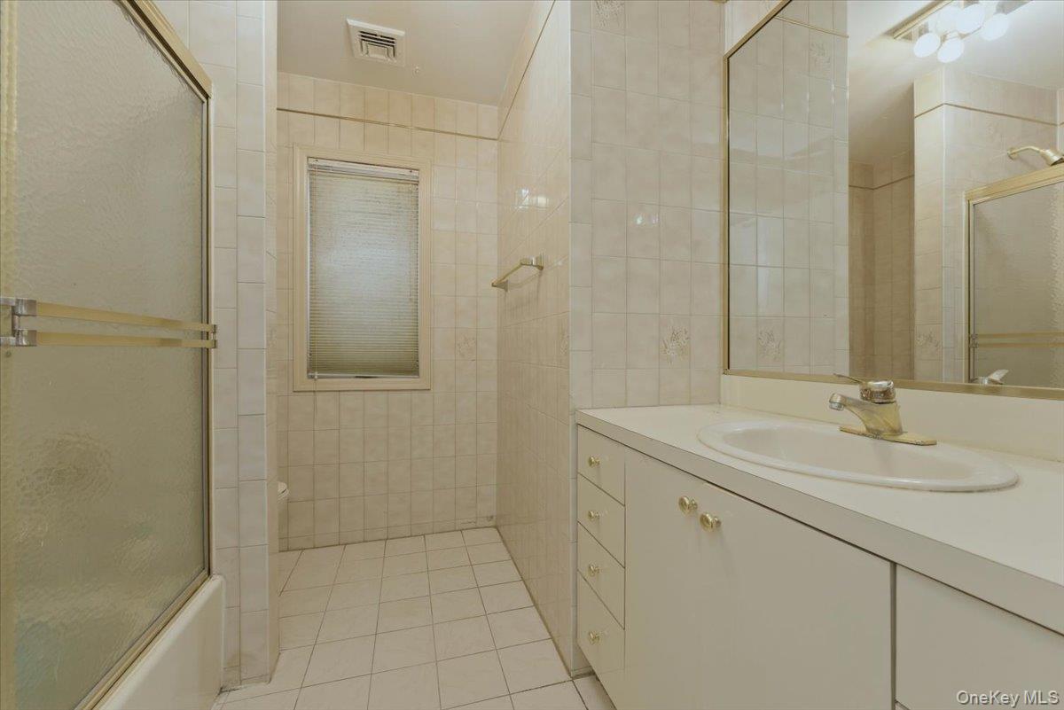 151 Wanser Avenue Inwood, NY 11096 - Photo 15 of 19 a bathroom with a sink and mirror
