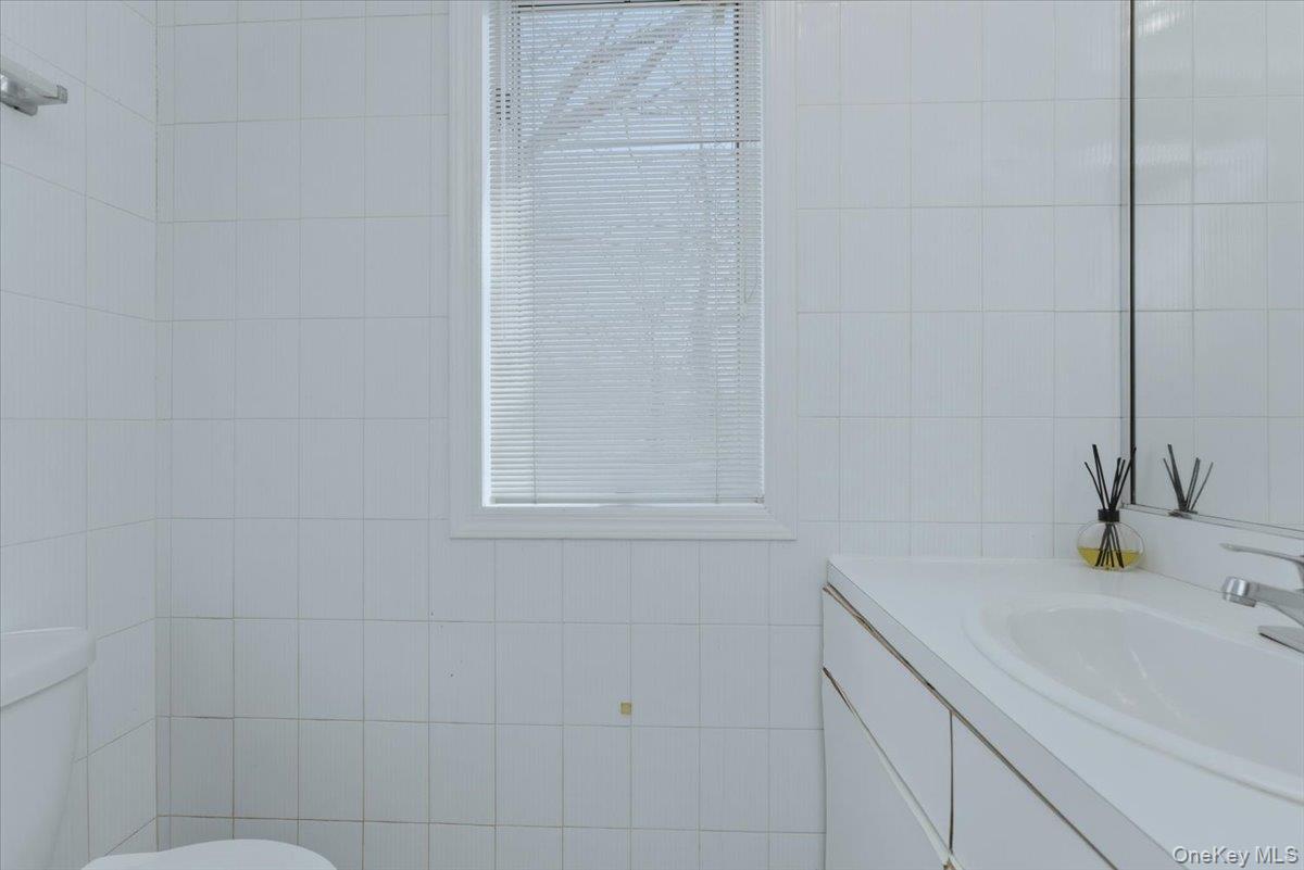 151 Wanser Avenue Inwood, NY 11096 - Photo 16 of 19 a bathroom with a sink and a shower