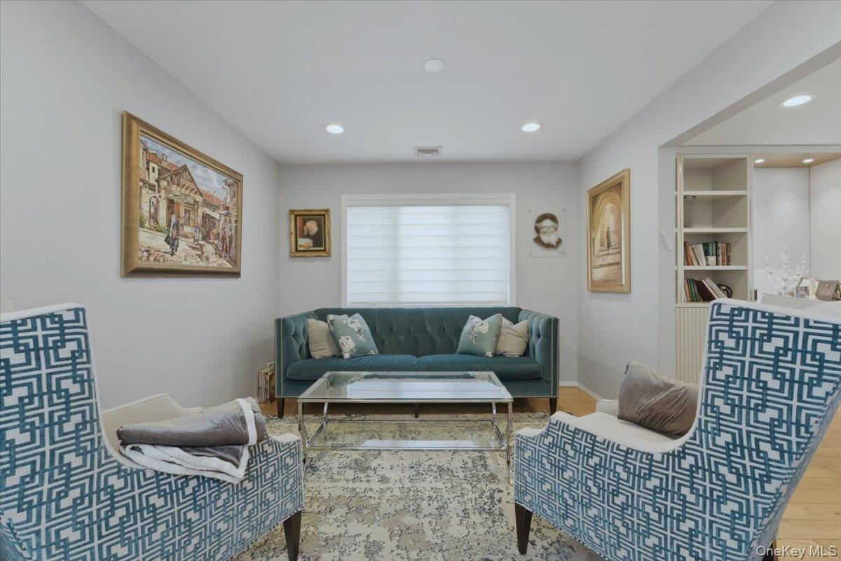 151 Wanser Avenue Inwood, NY 11096 - Photo 6 of 19 a living room with furniture and a couch