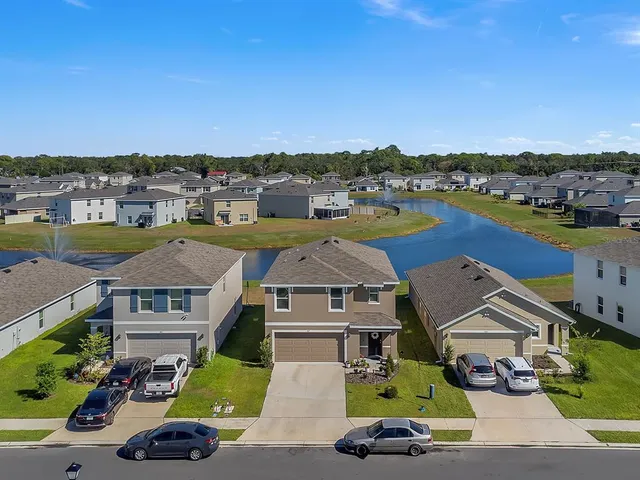 an aerial view of a house with a garden