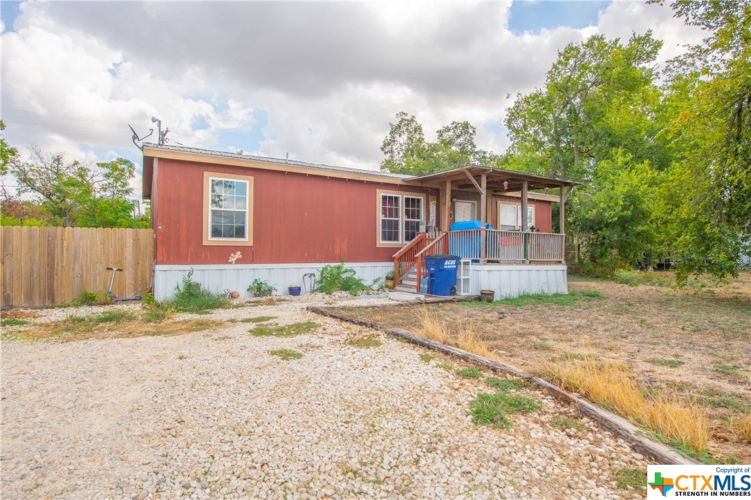 a front view of a house with a yard and a garage