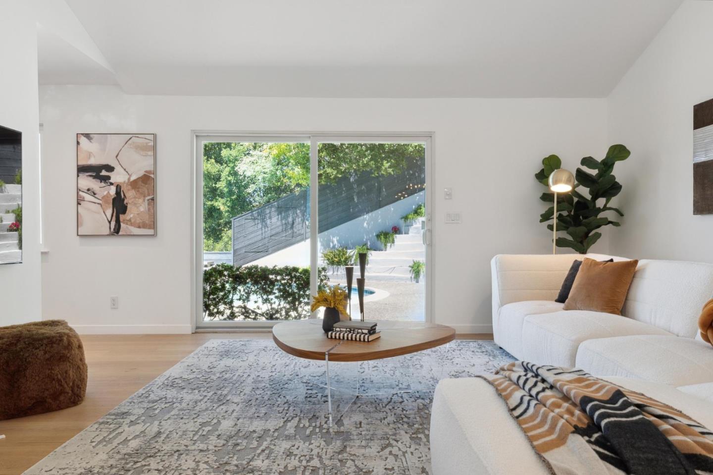 2620 Summit Drive Burlingame, CA 94010 - Photo 16 of 84 a living room with furniture and a potted plant