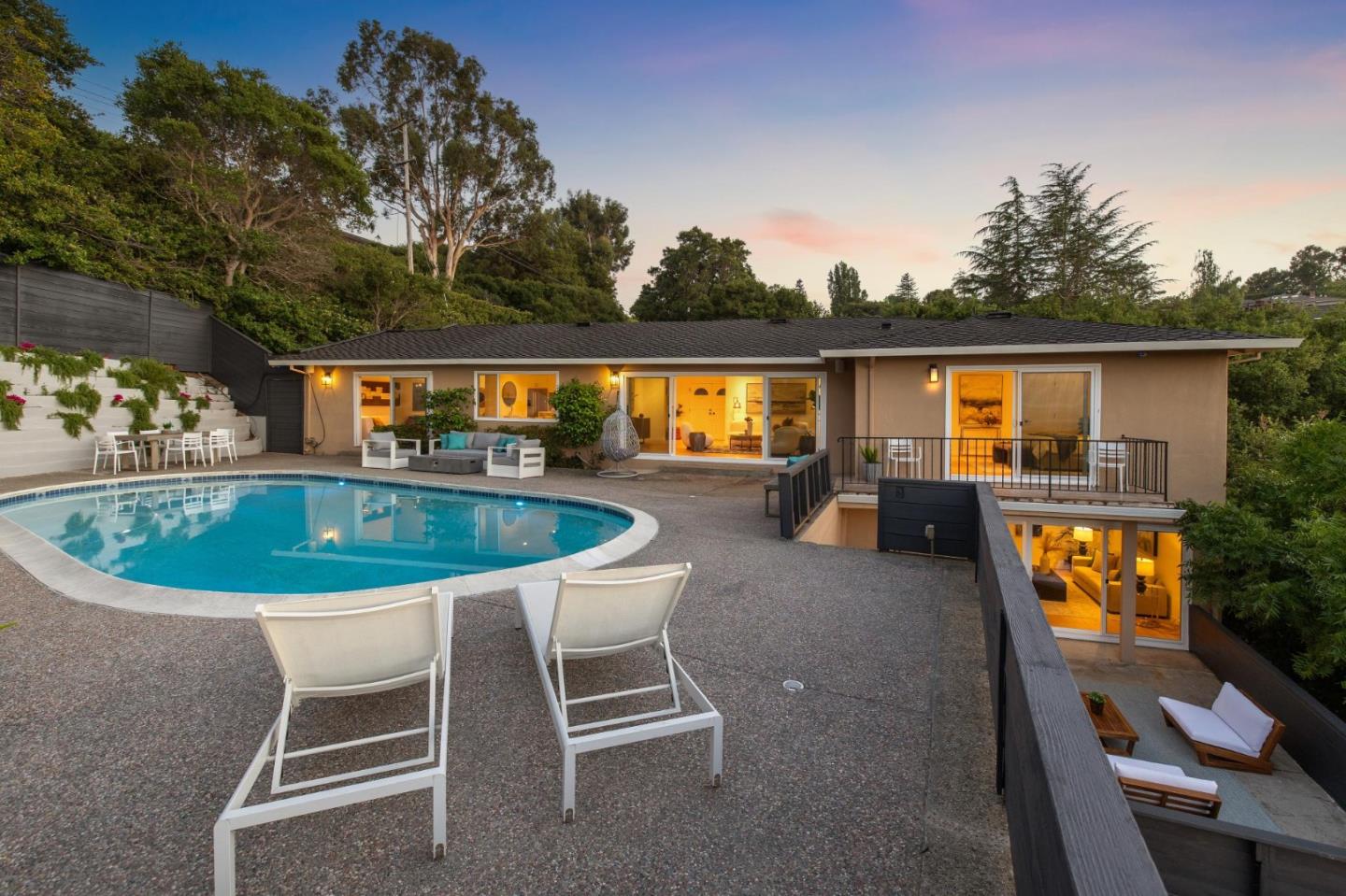 2620 Summit Drive Burlingame, CA 94010 - Photo 75 of 84 a swimming pool with outdoor seating and yard in the back