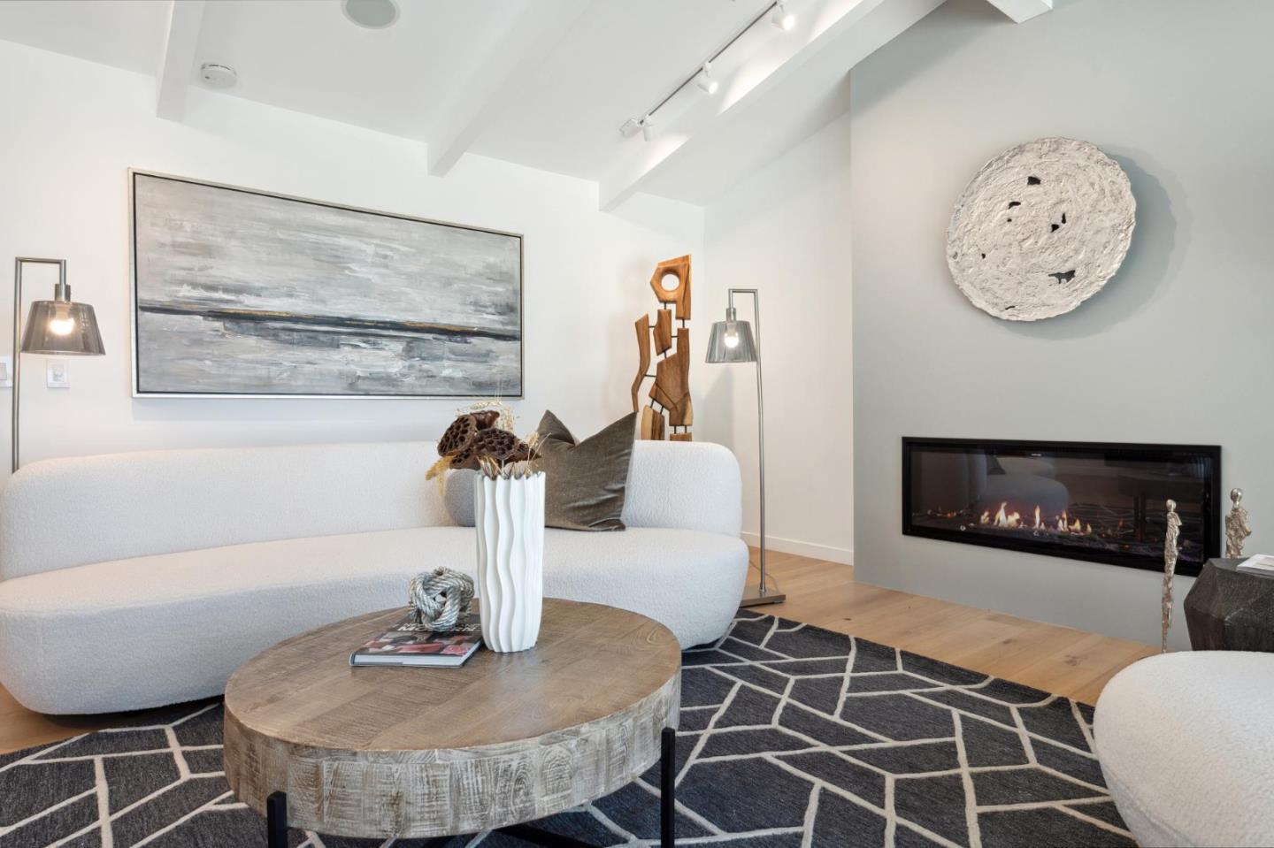 2620 Summit Drive Burlingame, CA 94010 - Photo 9 of 84 a living room with furniture a clock and a fireplace
