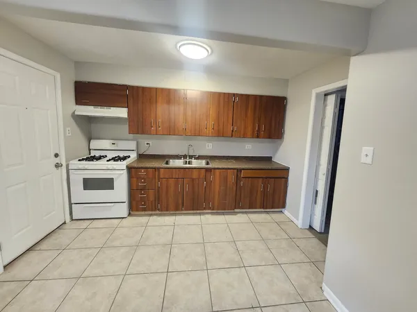 a kitchen with stainless steel appliances a stove a microwave and a refrigerator