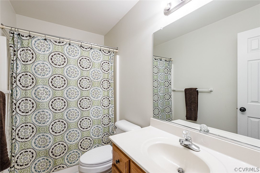 3701 Hazelnut Branch Road Midlothian, VA 23112 - Photo 34 of 39 a bathroom with a toilet sink shower and mirror