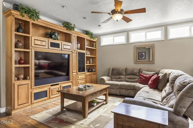 a kitchen with stainless steel appliances granite countertop a sink and a refrigerator