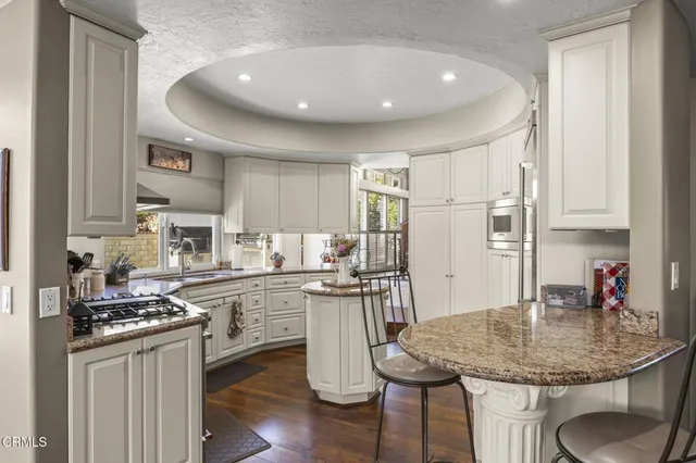 a room with lots of furniture and chandelier