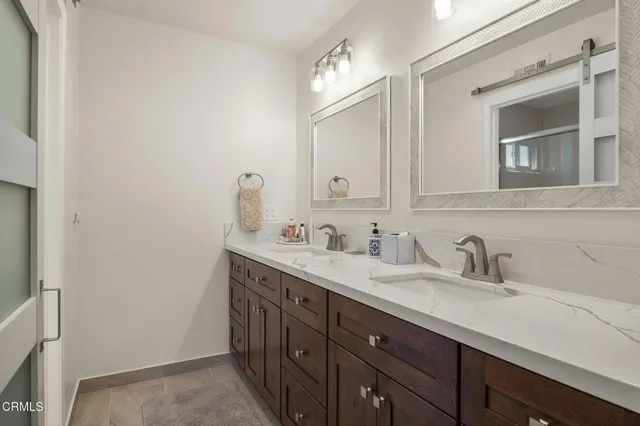 a utility room with sink dryer and washer