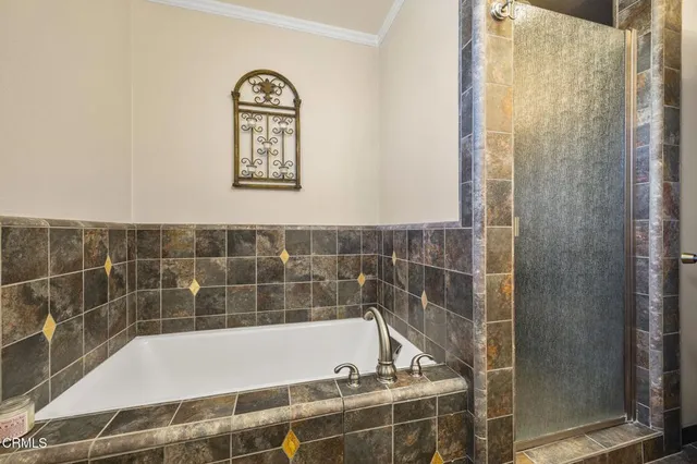 a view of a chairs and table in the back yard of the house