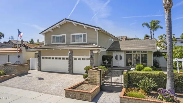 a view of a door with a chairs and table in a patio