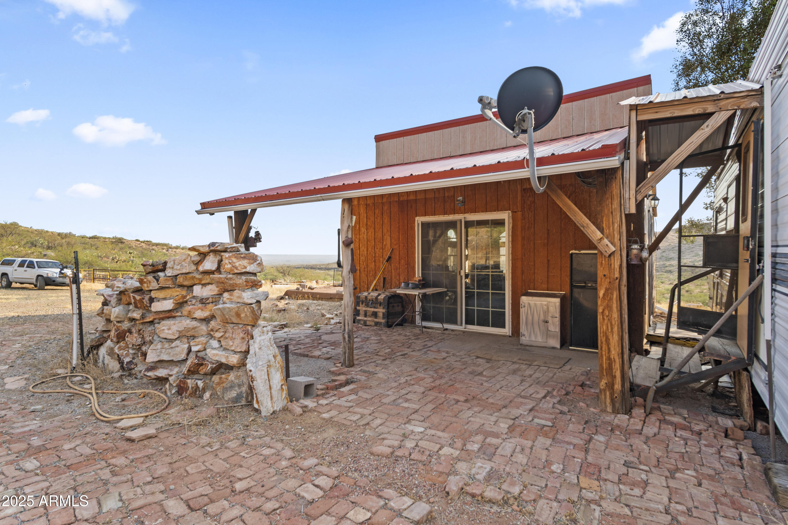 25795 South Old Stage Road Congress, AZ 85332 - Photo 4 of 30 a view of a patio with table and chairs near a barbeque