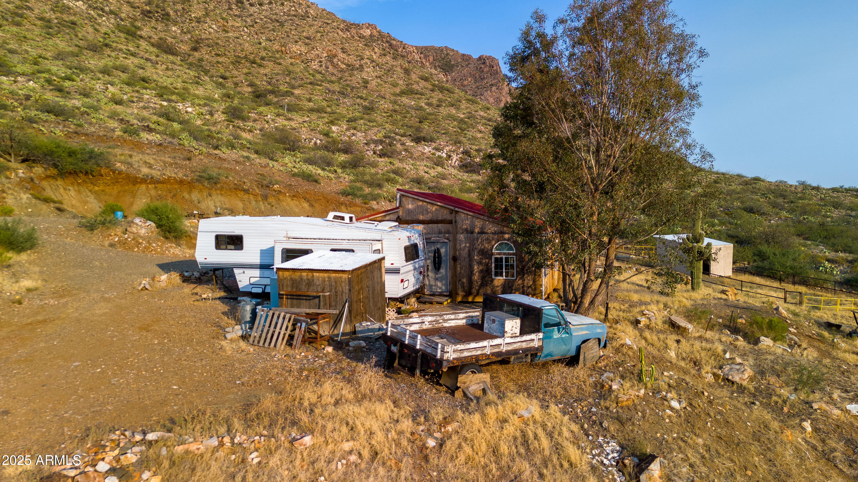 25795 South Old Stage Road Congress, AZ 85332 - Photo 7 of 30 a table and chairs sitting in a backyard of a house