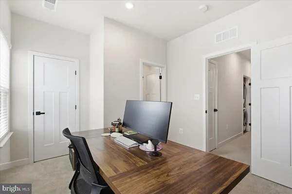 a workspace with furniture and wooden floor