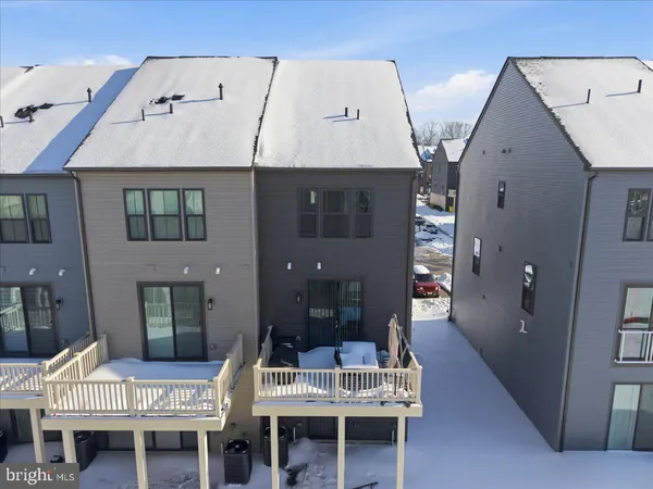 an aerial view of a house with sitting area