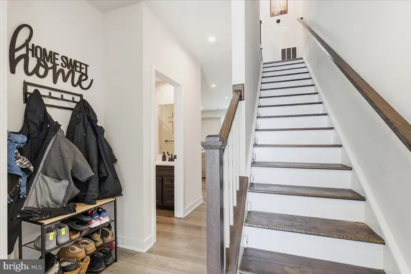 a view of an entryway with wooden floor