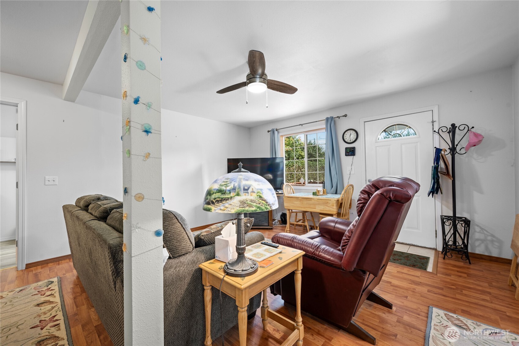 2019 Joe Johns Road Ocean Park, WA 98640 - Photo 12 of 28 a living room with furniture a window and a chandelier