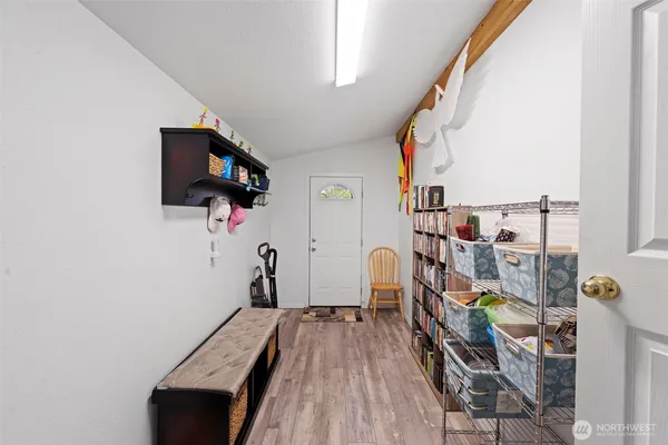 a bathroom with a sink a toilet and shower curtain