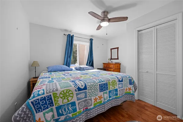 a bedroom with a bed and a window
