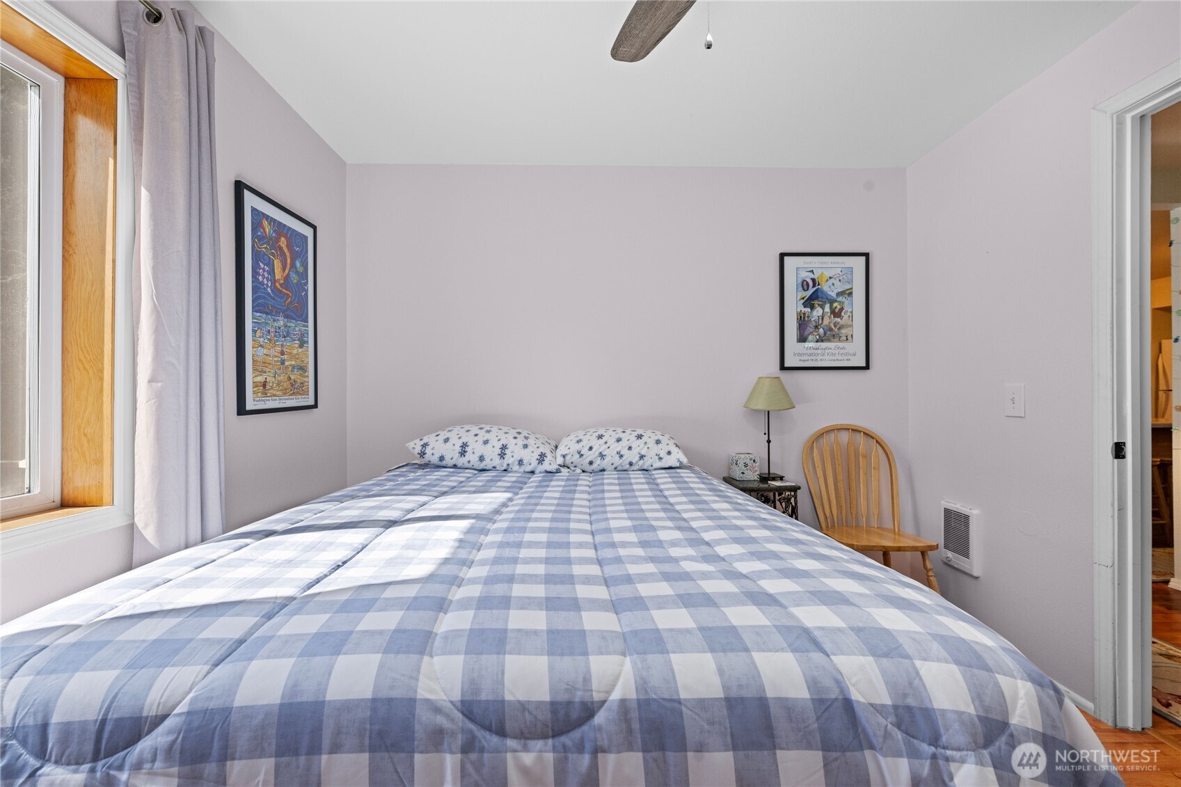 2019 Joe Johns Road Ocean Park, WA 98640 - Photo 25 of 28 a bedroom with a bed and a painting on the wall