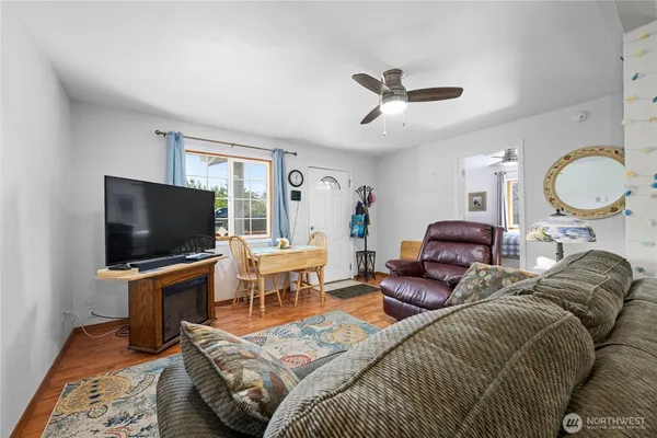 a living room with a couch and a chandelier