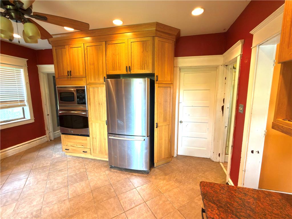4550 Vera Cruz Road Center Valley, PA 18034 - Photo 25 of 43 Rich wood cabinetry paired with classic tile flooring anchors this warm interior.