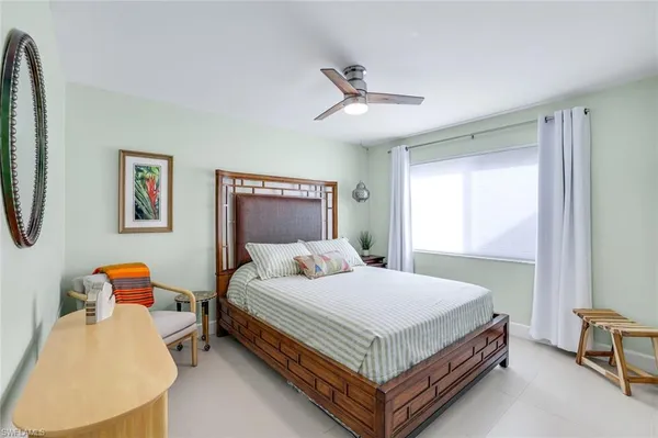 a bedroom with a bed and window