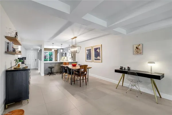 a view of a livingroom with furniture and a window