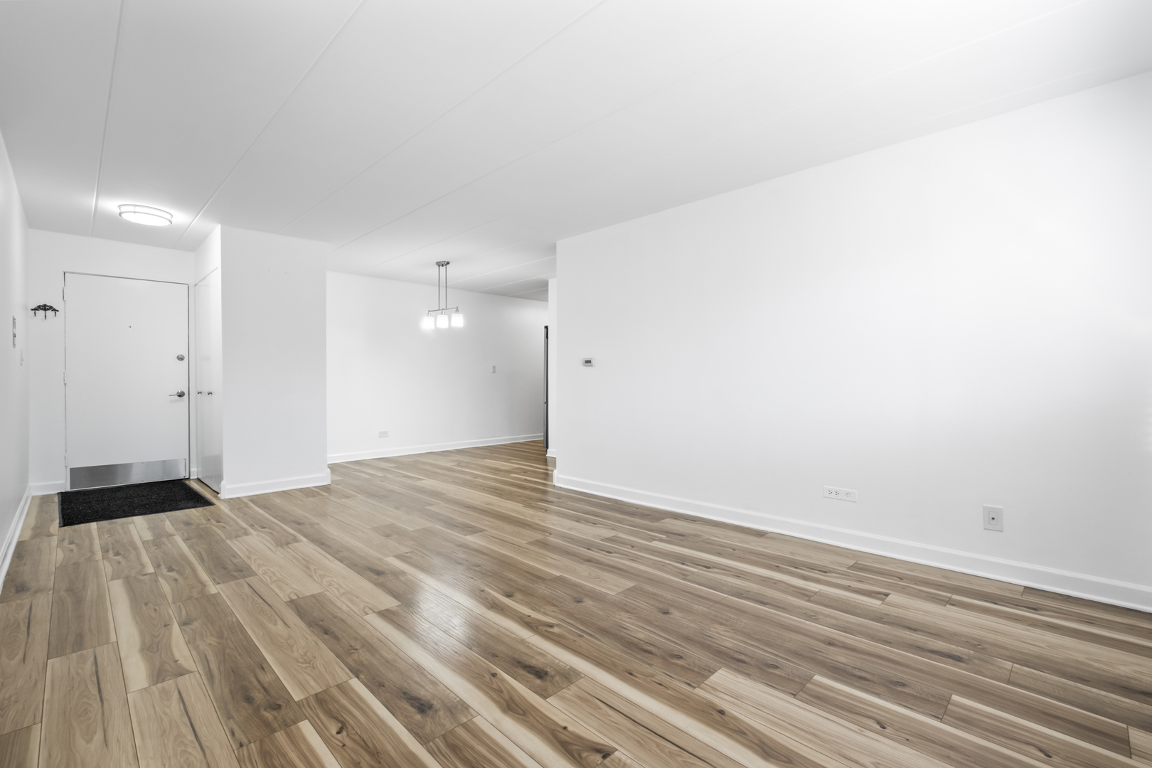 2521 Thatcher Avenue, Unit 2I River Grove, IL 60171 - Photo 12 of 18 a view of an empty room and wooden floor