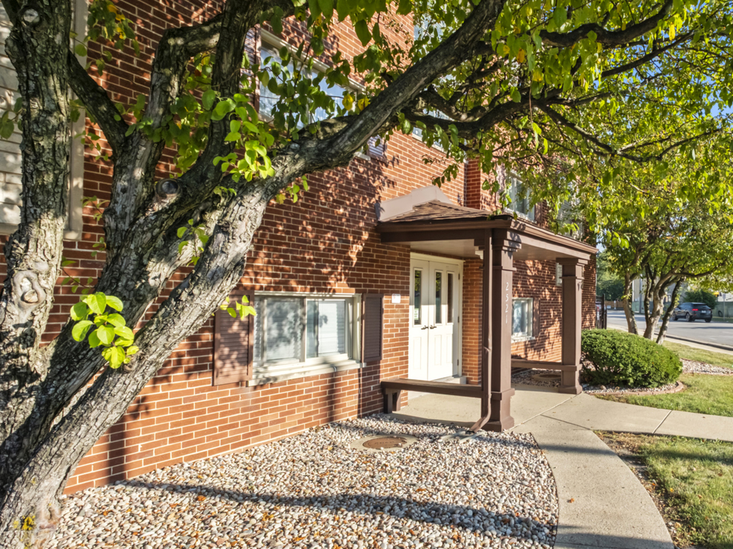 2521 Thatcher Avenue, Unit 2I River Grove, IL 60171 - Photo 2 of 18 a view of a house with a tree