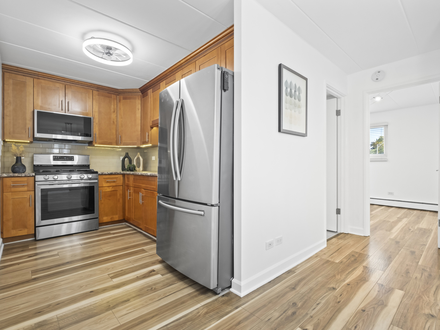 2521 Thatcher Avenue, Unit 2I River Grove, IL 60171 - Photo 6 of 18 a kitchen with a refrigerator a stove top oven a sink and dishwasher