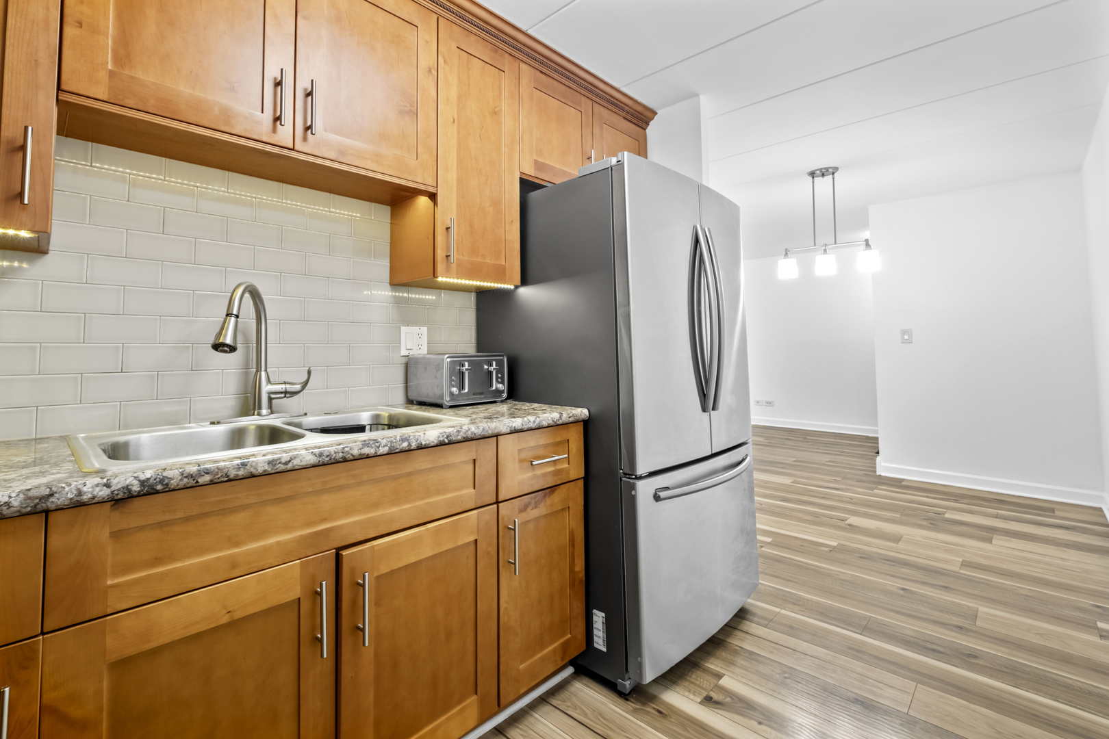 2521 Thatcher Avenue, Unit 2I River Grove, IL 60171 - Photo 8 of 18 a kitchen with stainless steel appliances granite countertop a refrigerator and a sink