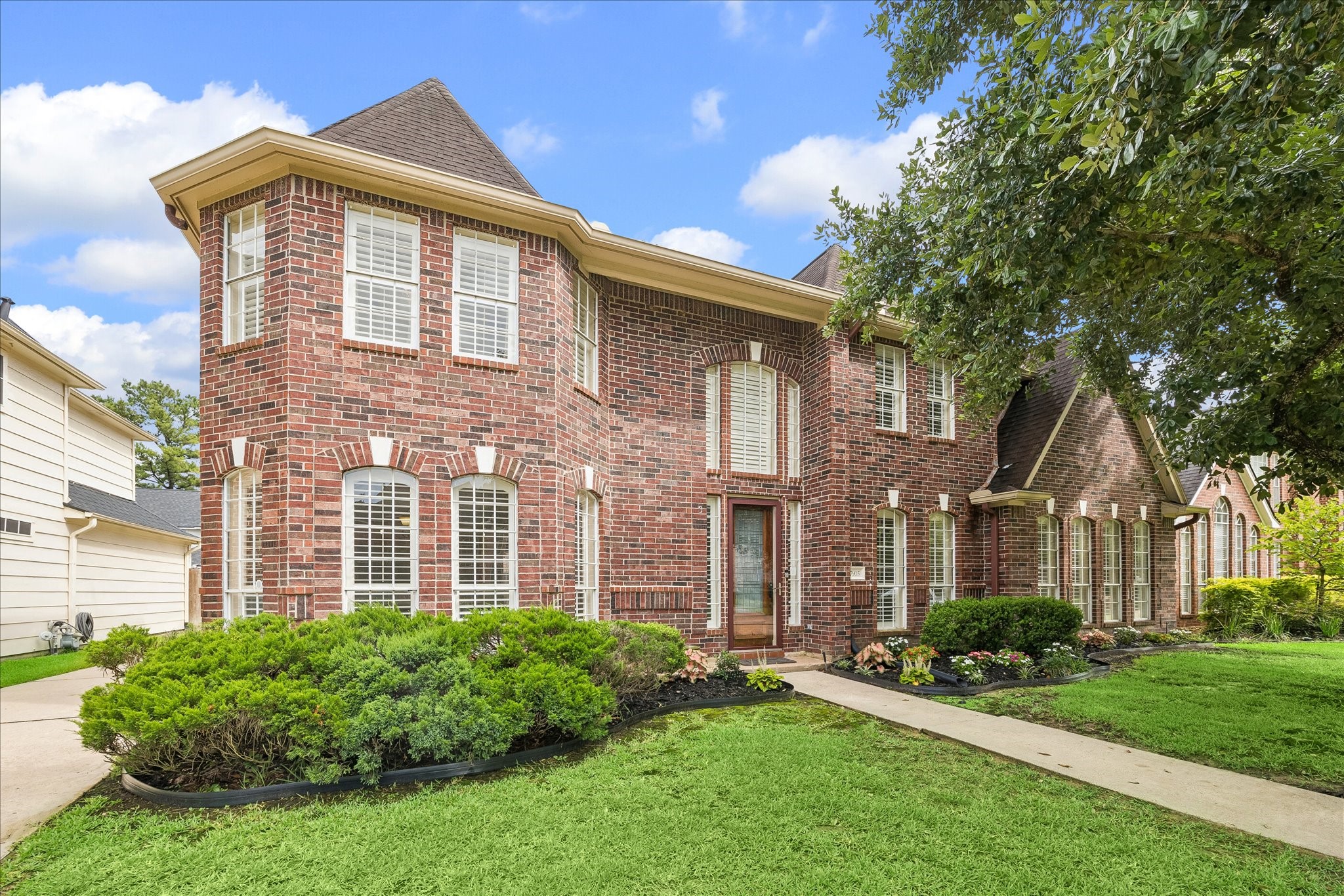 7915 Huddersfield Court Spring, TX 77379 - Photo 1 of 37 Classic brick exterior with manicured landscaping, mature trees, and a welcoming front approach set the tone for this beautifully refreshed cul-de-sac home.