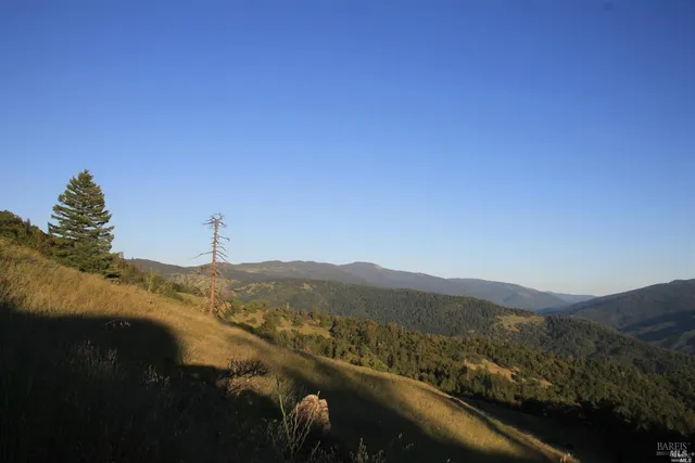 a view of a town with mountains in the background