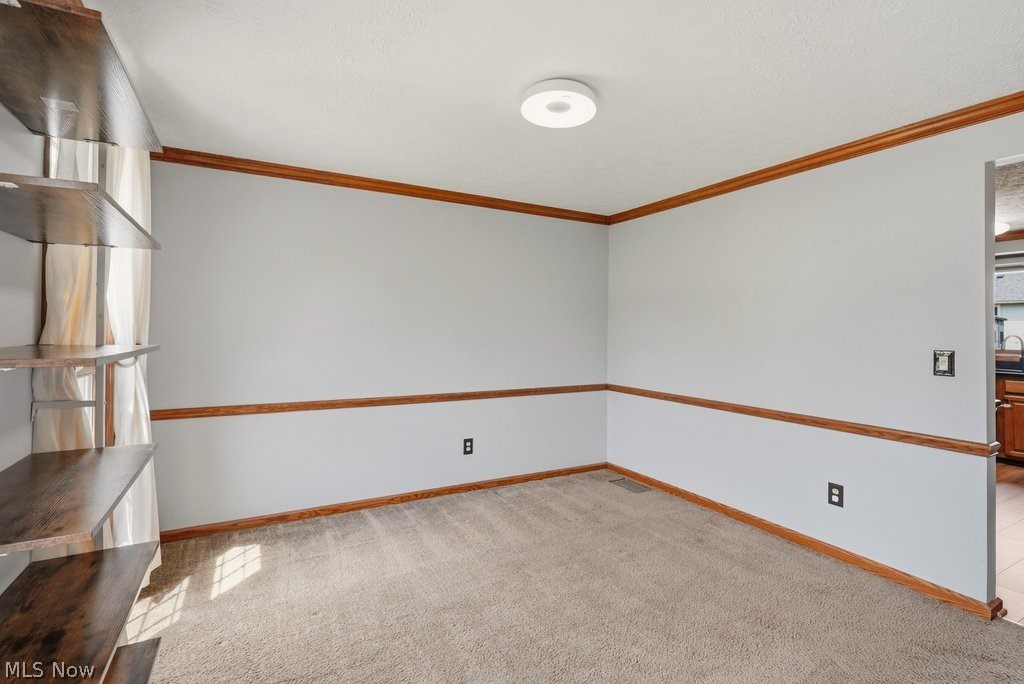 5321 Young Road Stow, OH 44224 - Photo 19 of 37 Wall-mounted shelving system featuring dark wood-finish shelves