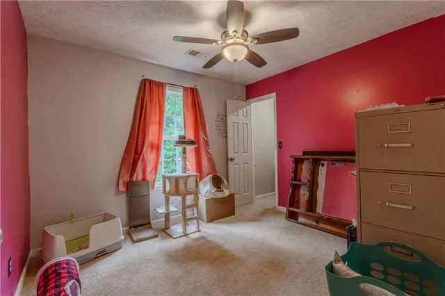 a bathroom with a granite countertop sink toilet a mirror and shower