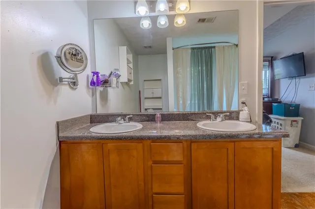 a bath tub sitting in a bathroom next to a window
