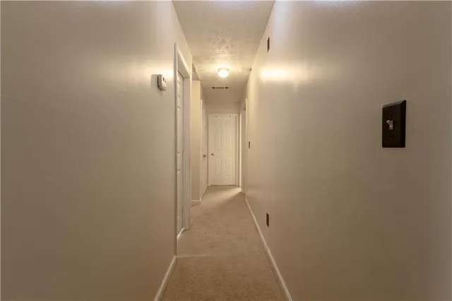 a bedroom with a bed and a dresser in it