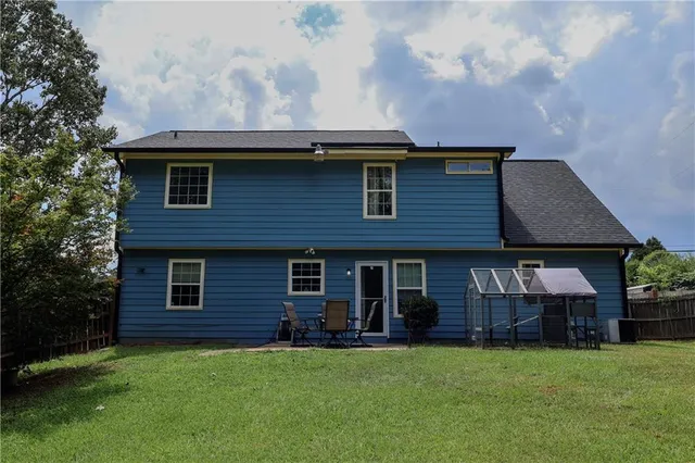 a brick house with a yard