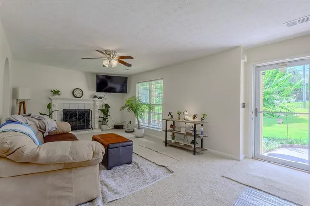a bedroom with furniture and a window