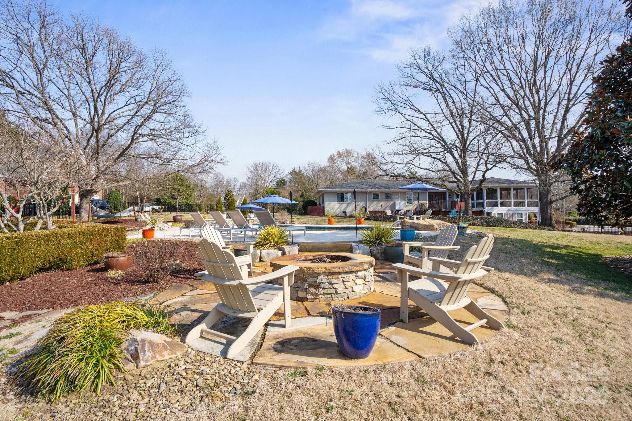 13031 Westmoreland Farm Road Davidson, NC 28036 - Photo 12 of 45 a view of a backyard with sitting area