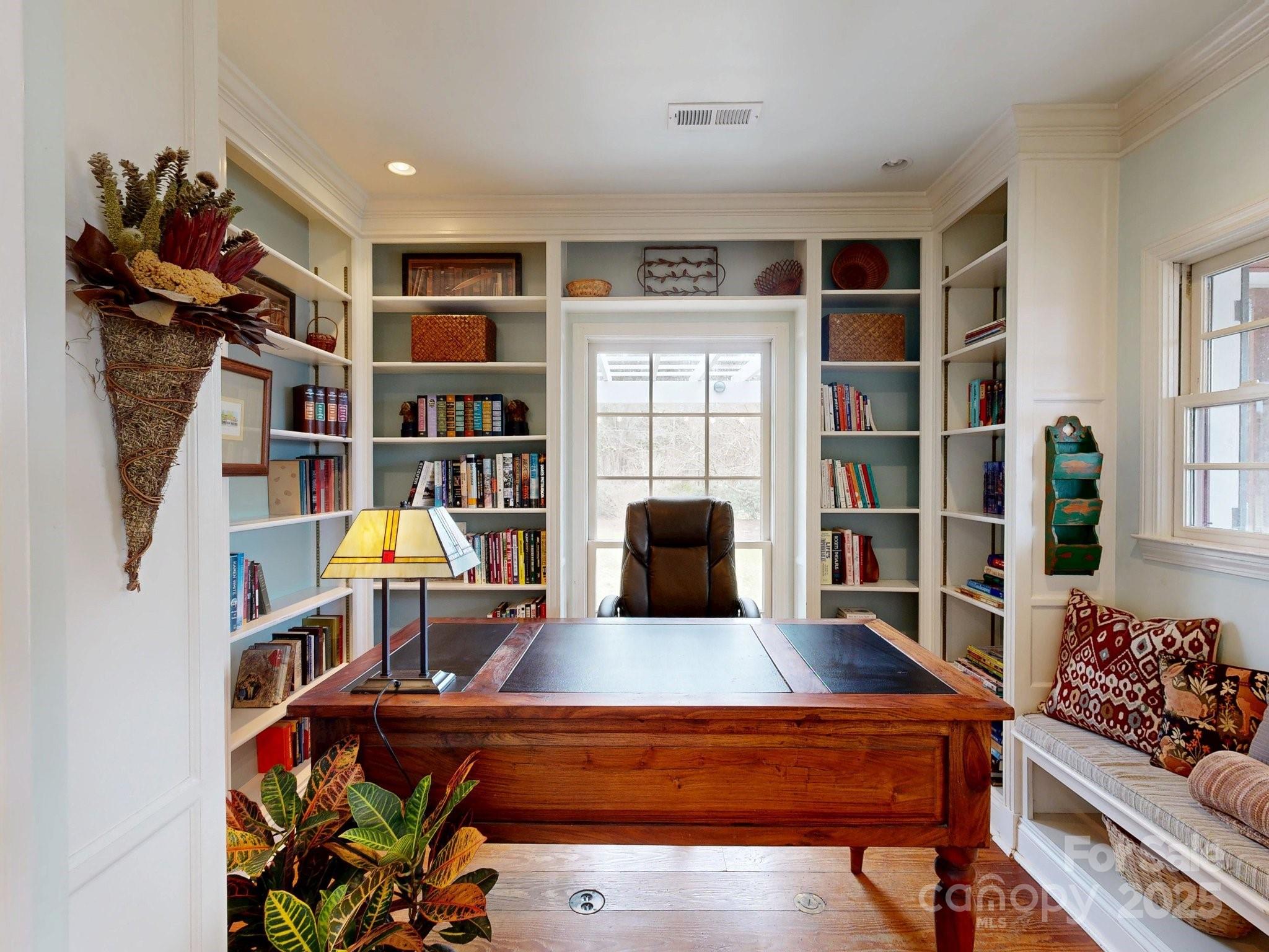 13031 Westmoreland Farm Road Davidson, NC 28036 - Photo 15 of 45 a living room with furniture a rug and a book shelf
