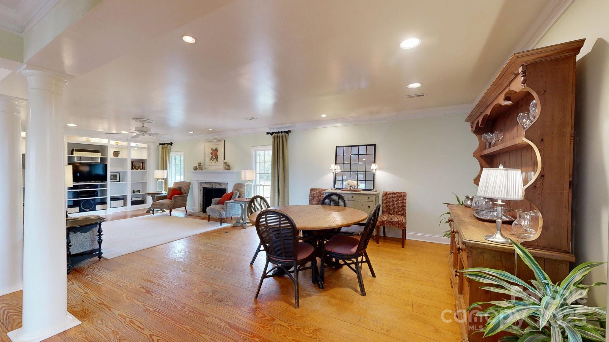 13031 Westmoreland Farm Road Davidson, NC 28036 - Photo 16 of 45 a view of a dining room with furniture and wooden floor