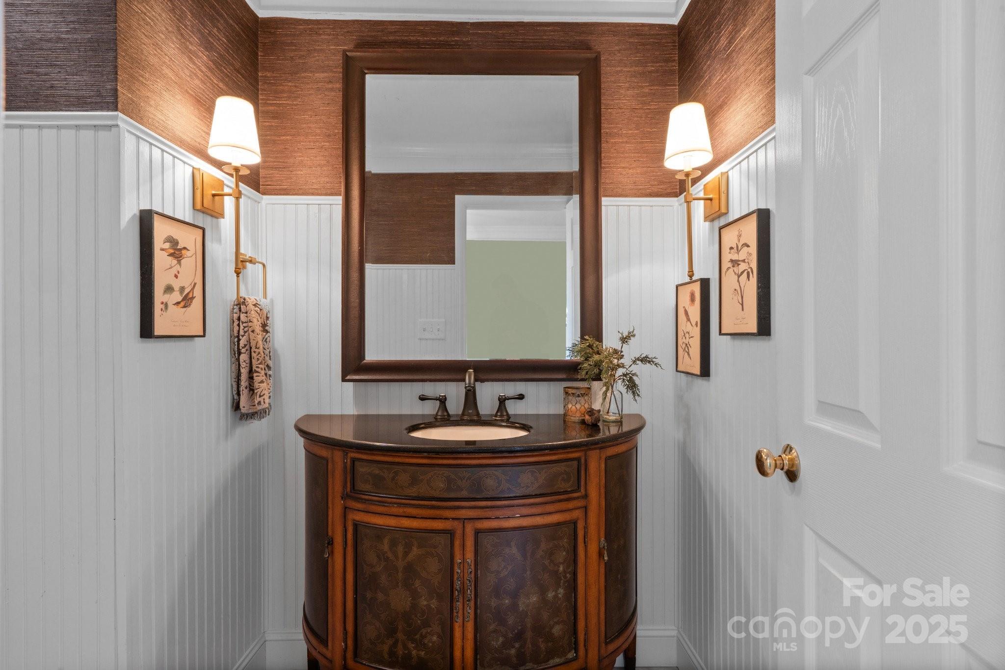 13031 Westmoreland Farm Road Davidson, NC 28036 - Photo 21 of 45 a bathroom with a sink and a mirror