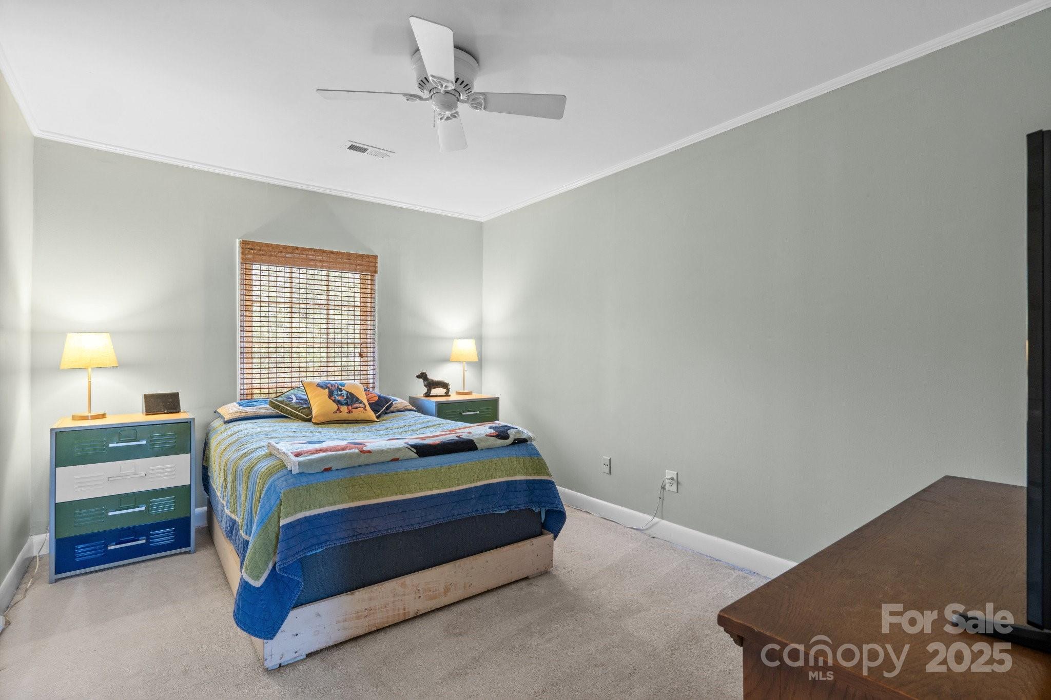 13031 Westmoreland Farm Road Davidson, NC 28036 - Photo 26 of 45 a bedroom with bed and window