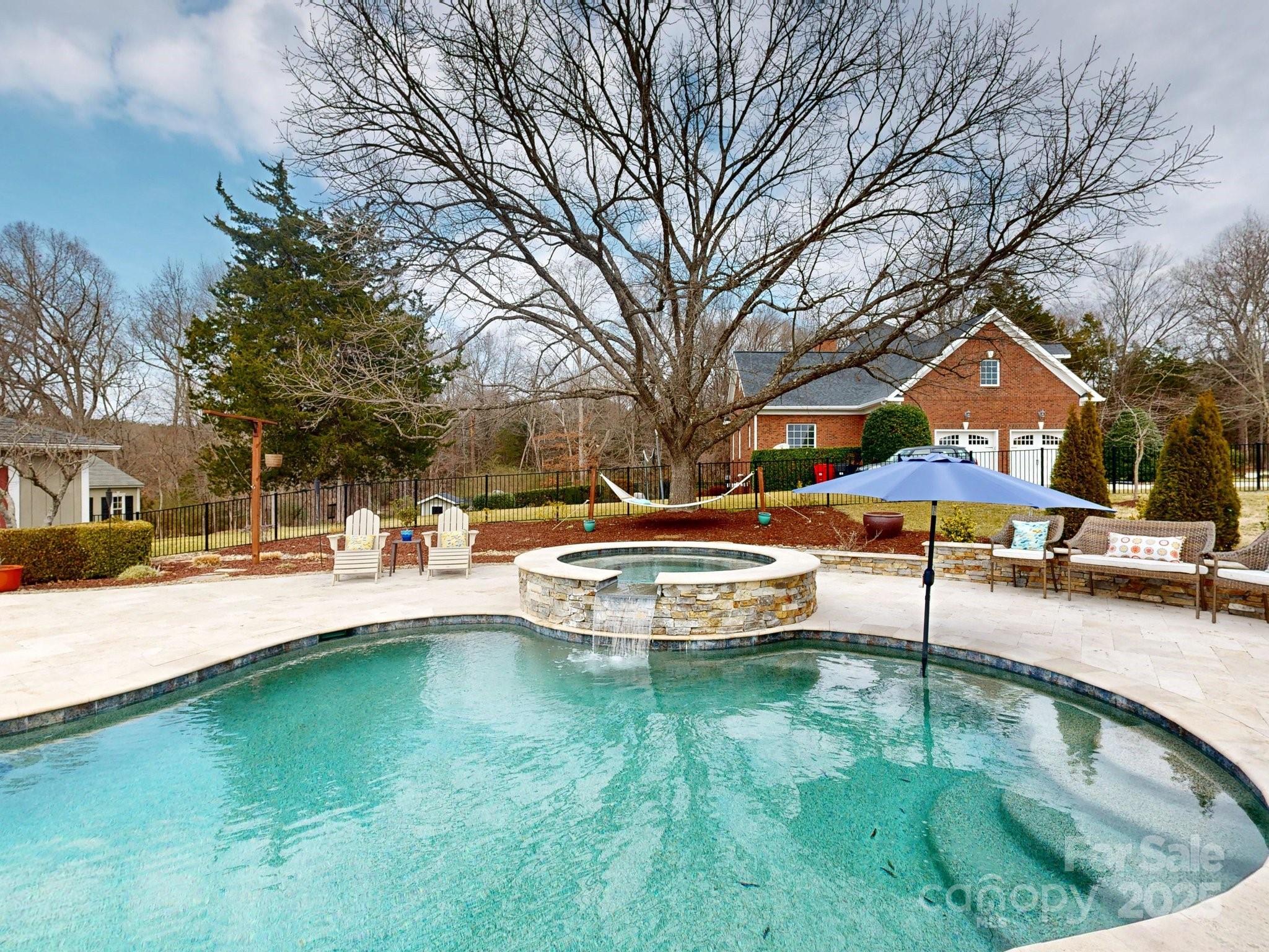 13031 Westmoreland Farm Road Davidson, NC 28036 - Photo 7 of 45 a swimming pool with outdoor seating and yard
