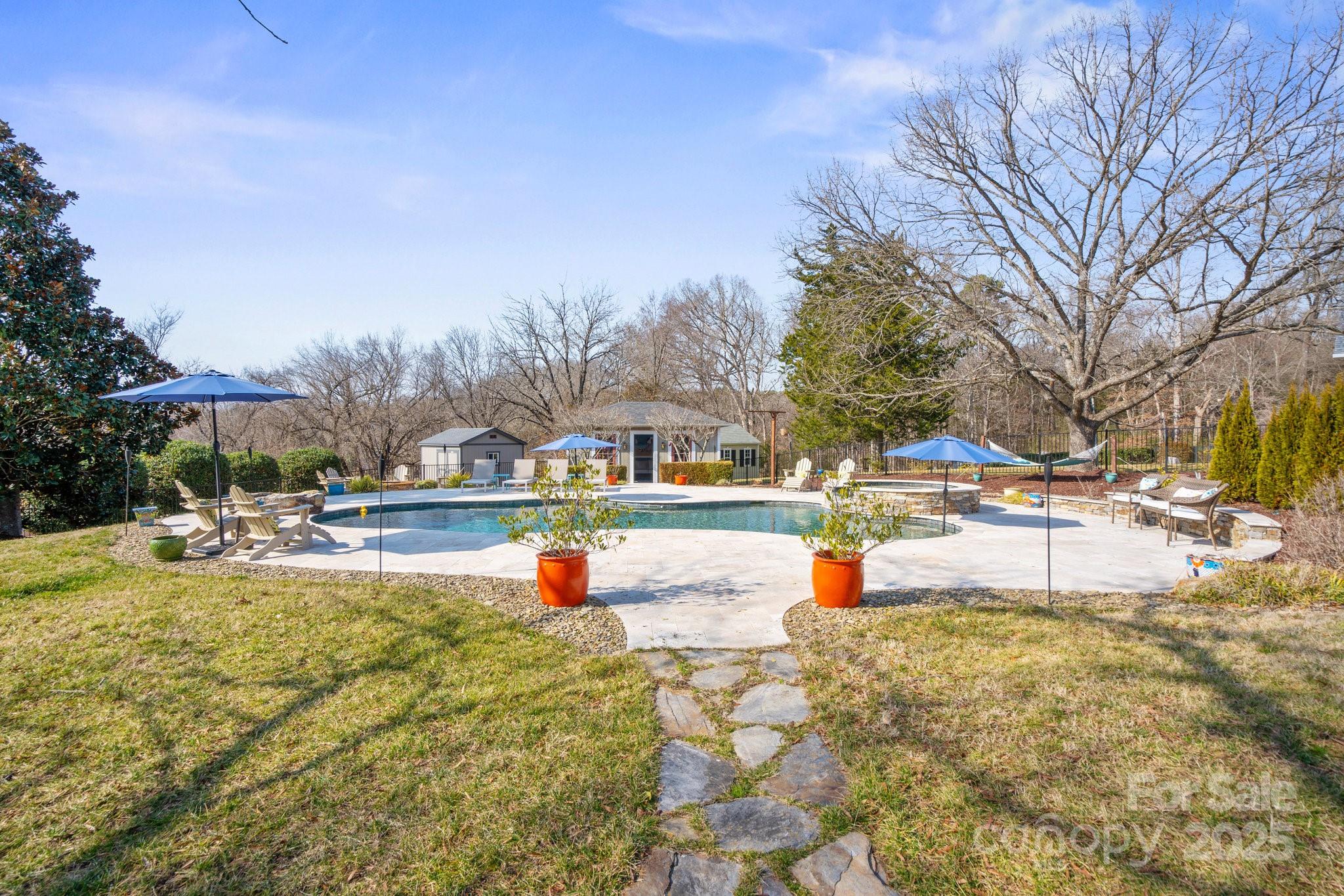 13031 Westmoreland Farm Road Davidson, NC 28036 - Photo 9 of 45 a view of swimming pool with outdoor seating