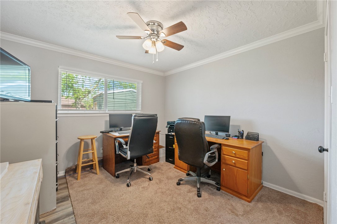 2911 Oakside Drive Bryan, TX 77802 - Photo 15 of 23 a view of a workspace with furniture and a window